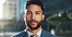 Business, portrait and serious with man in city for commercial real estate or property development. Architecture, buildings and infrastructure with confident employee in urban town for opportunity