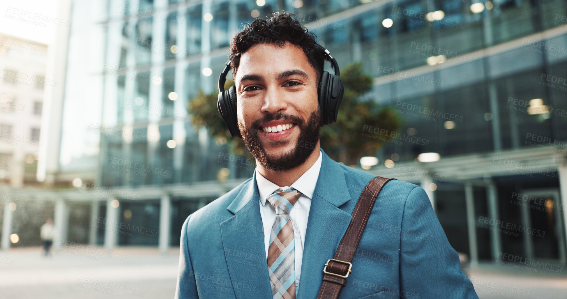 Buy stock photo Business, music and portrait with happy man in city for commute or travel to work location. Buildings, headphones and smile of corporate employee outdoor in urban town for new job opportunity