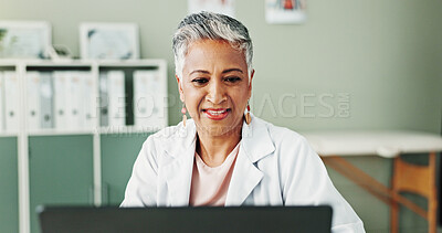 Buy stock photo Laptop, woman and doctor in office, healthcare or research for diagnosis, cure or treatment. Mature person, medical or professional in workplace, computer or email for test results, internet or smile