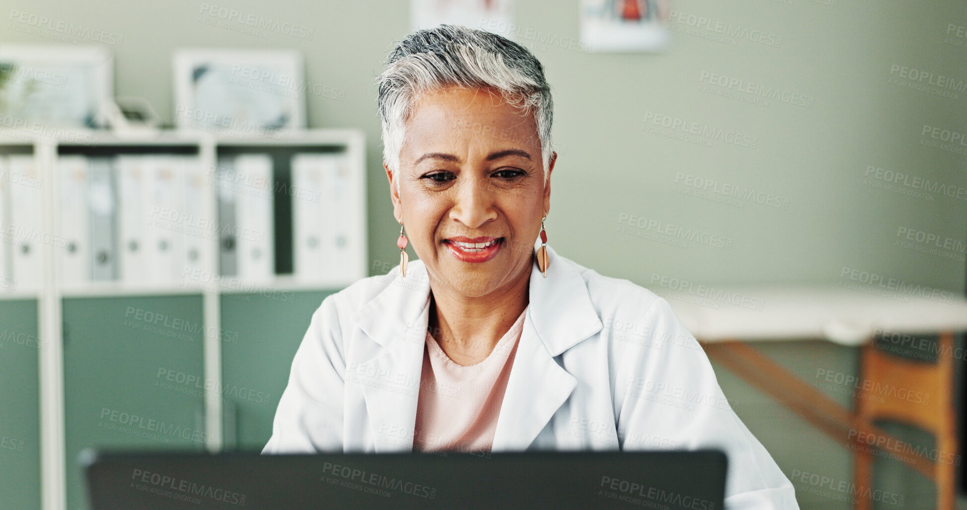 Buy stock photo Laptop, woman and doctor in office, healthcare or research for diagnosis, cure or treatment. Mature person, medical or professional in workplace, computer or email for test results, internet or smile