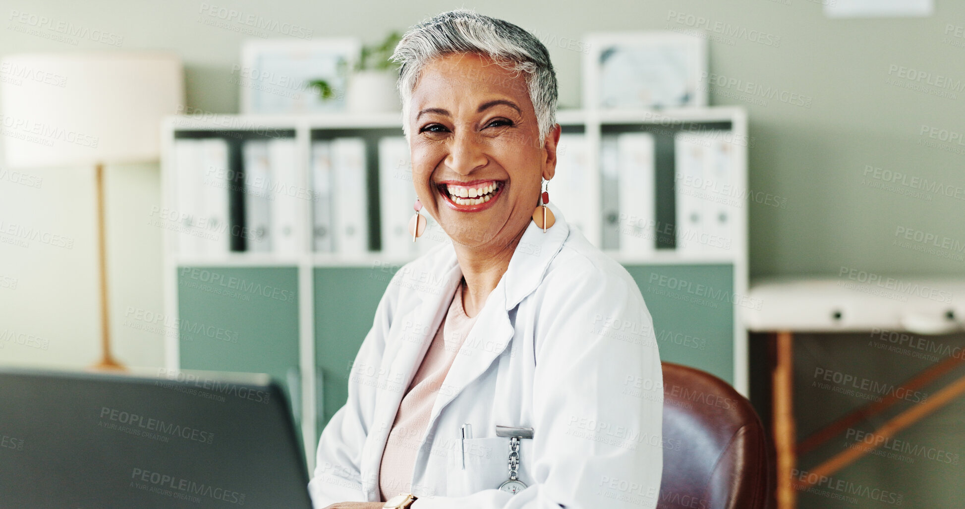 Buy stock photo Mature, doctor or happy woman with portrait, healthcare or confidence for wellness in clinic. Laptop, office and person in hospital for career, pharmaceutical medicine or medical service in Mexico