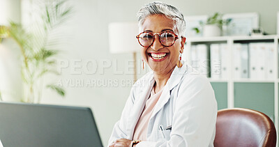 Buy stock photo Mature, doctor or happy woman with portrait, laptop or confidence for wellness in clinic. Smile, office and proud person in hospital for career, pharmaceutical medicine or medical service in Mexico