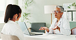 Appointment, laptop or medical with doctor and patient in office of hospital for consulting. Computer, feedback or healthcare with mature medicine professional and woman in clinic for treatment