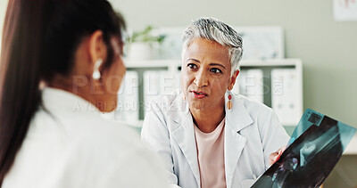 Buy stock photo Appointment, checkup or radiology with doctor and patient in office of hospital for consulting. Conversation, medical or x ray with mature medicine professional and woman in clinic for treatment