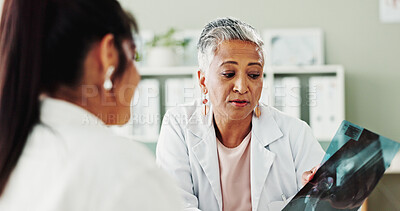 Buy stock photo Consulting, healthcare or x ray with doctor and patient in office of hospital for diagnosis. Appointment, feedback or radiology with mature medical professional and woman in clinic for treatment