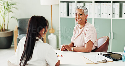 Buy stock photo Appointment, healthcare and smile of doctor with patient in office of hospital for consulting. Cardiology, feedback or medical with mature medicine professional and woman in clinic for treatment
