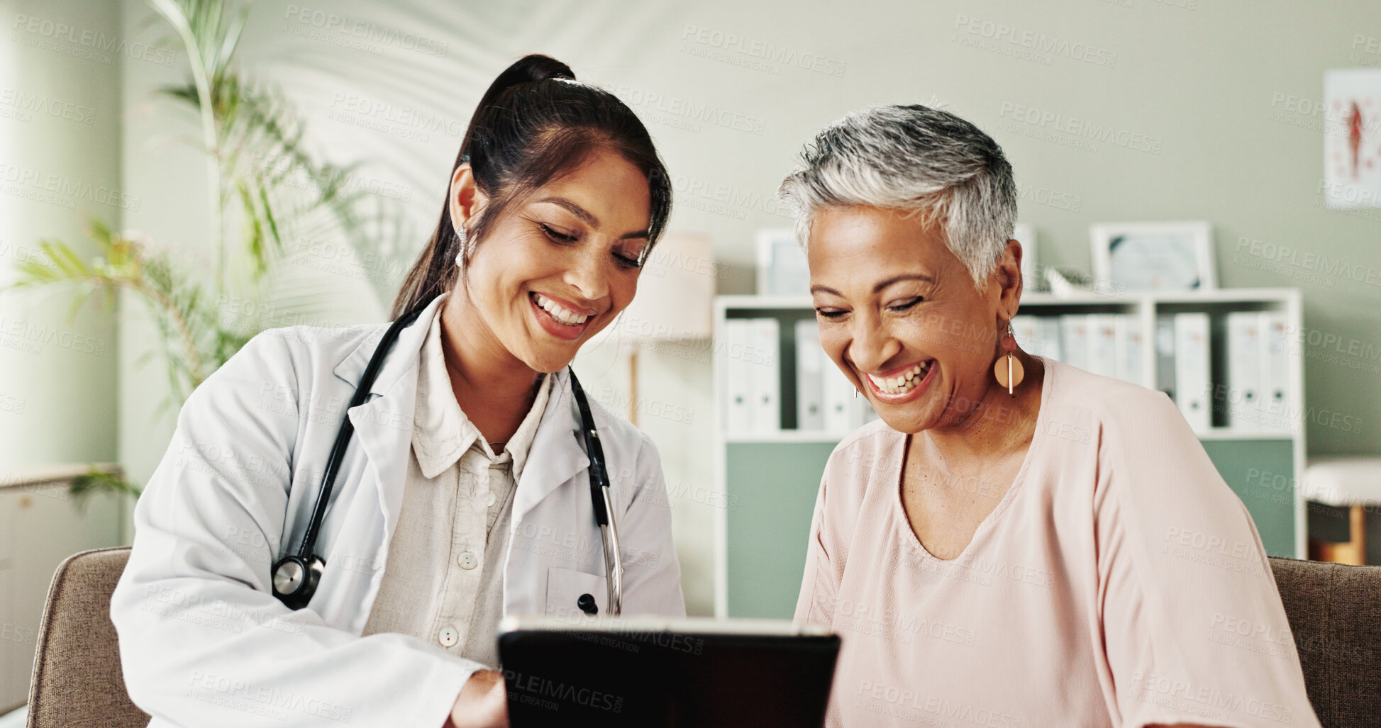 Buy stock photo Happy, doctor and senior woman on tablet in office for good news, research and online results of diagnosis. People, digital and smile of healthcare, insurance checklist and treatment plan and medical
