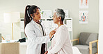 Doctor, stethoscope and senior woman in office for cardiology, listen to heartbeat and healthcare exam. People, evaluation and check breathing, cardiovascular sound and diagnosis for medical services
