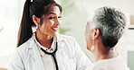 Woman, therapist and mature patient for consulting, support or conversation with checkup appointment in office. Female person, medical professional and healthcare talk for senior customer at clinic