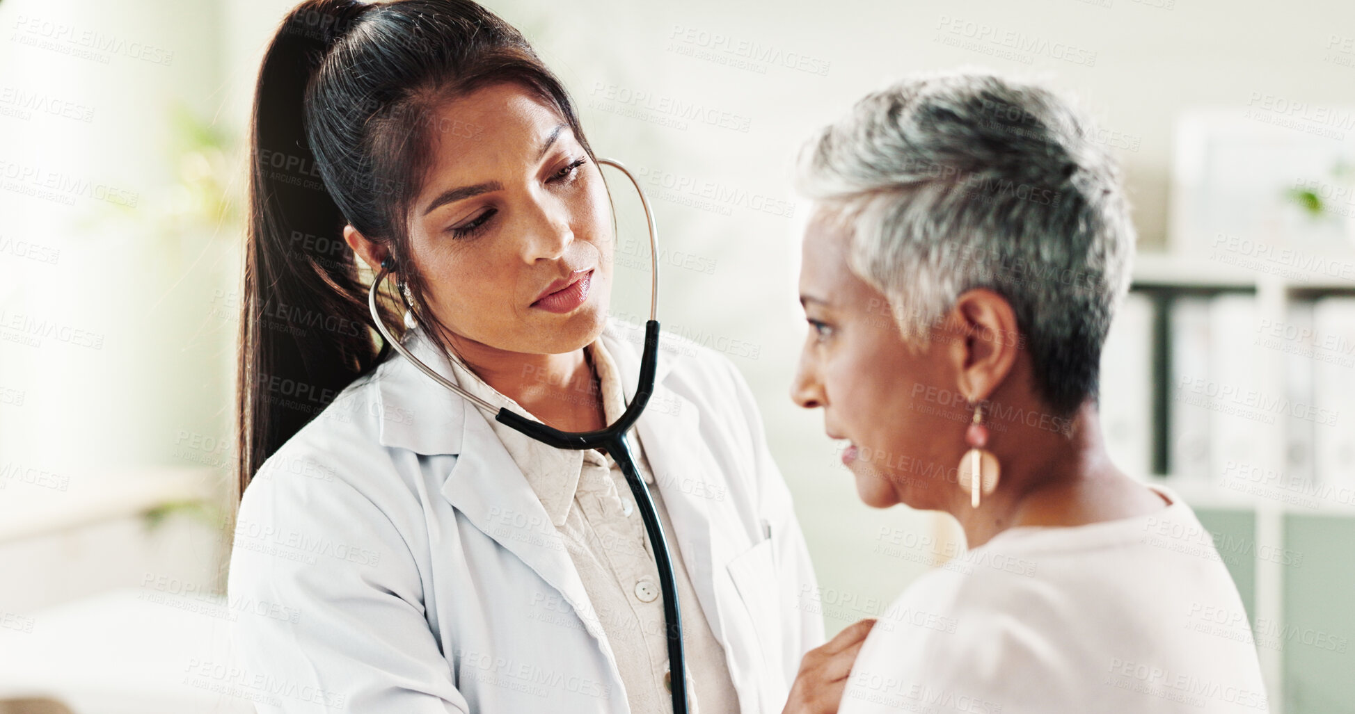 Buy stock photo Doctor, stethoscope and elderly woman in office of cardiology, listen to heartbeat and healthcare exam. People, evaluation and check breathing, cardiovascular sound and diagnosis for medical services