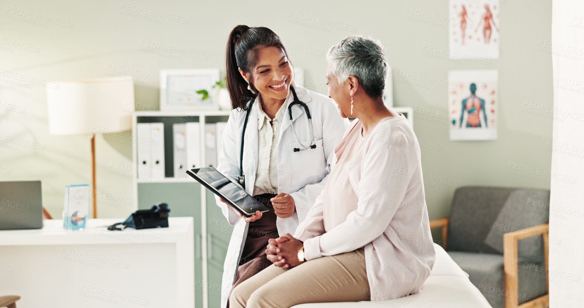 Buy stock photo Mature patient, doctor and tablet for healthcare, support or conversation with checkup appointment in office. Female person, medical professional and diagnosis talk for senior woman at clinic