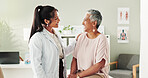 Clinic, doctor and check up with mature woman, discussion and healthcare, service and consultation. Hospital, caregiver and person with patient in office, test and support of medical professional