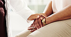 Healthcare, patient and doctor with holding hands for empathy, kindness and support for cancer disease. People, client and medical employee with sorry for diagnosis, courage and illness in closeup