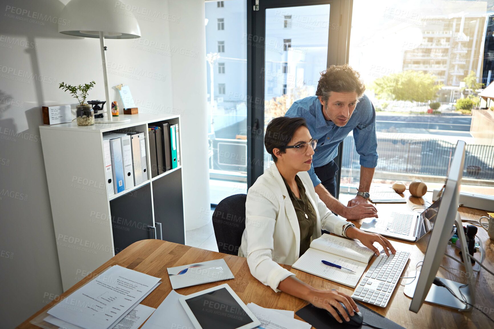 Buy stock photo Computer, coaching and team of business people planning for feedback, advice or sales budget in office. Mentor, help and training intern in meeting for cooperation, discussion and learning new skills
