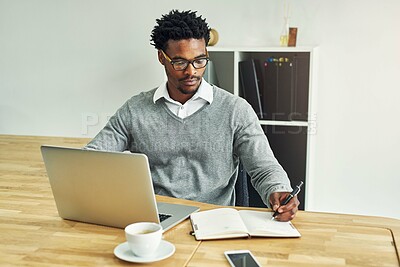 Buy stock photo Business, black man and writing in office with laptop for daily schedule or planning and goal setting for time management. Male employee, serious and digital technology with journal for research.