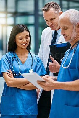 Buy stock photo Doctor, group and hospital teamwork with tablet for research or telehealth communication, online or consultation. Men, woman and medical app for client conversation or internet, website or insurance