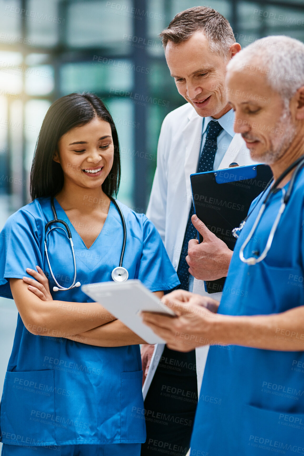 Buy stock photo Doctor, group and hospital teamwork with tablet for research or telehealth communication, online or consultation. Men, woman and medical app for client conversation or internet, website or insurance