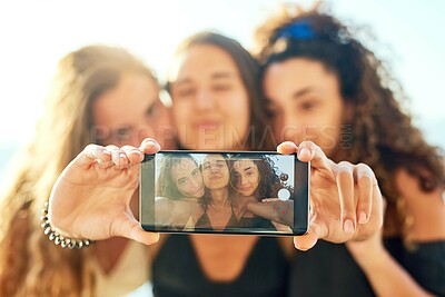 Buy stock photo Girl, friends and selfie for vacation, phone screen and hands for bonding, connection or memory with photography. Women, people and group for smile in profile picture on app for social media in Italy