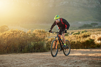 Buy stock photo Bike, hobby and off road with man in mountains for outdoor adrenaline, adventure or training. Exercise, fitness and sports with person cycling in nature for challenge, competition or performance