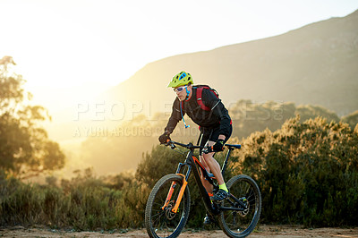 Buy stock photo Bicycle, off road and sports with man in mountains for outdoor adrenaline, adventure or training. Exercise, fitness and hobby with cyclist biking in nature for challenge, competition or performance