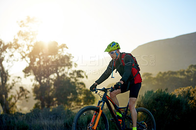 Buy stock photo Mountain bike, off road and sports with man outdoor for adrenaline, adventure or cardio training. Exercise, fitness and hobby with person cycling in nature for challenge, competition or performance