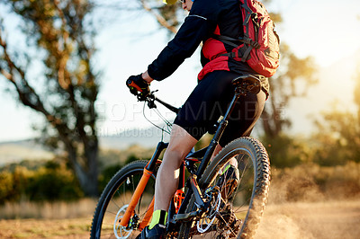 Buy stock photo Person, cycling or dirt road with bicycle for extreme sport, fitness or cardio workout in nature. Active, cyclist or riding with mountain bike or backpack for adrenaline rush or outdoor exercise