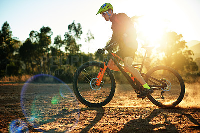 Buy stock photo Man, extreme cycling or sunset with dust on dirt track for fitness, adrenaline rush or sport in nature. Active, cyclist or riding with bicycle for training, cardio workout or outdoor exercise on road
