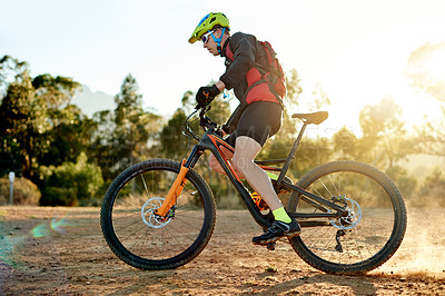 Buy stock photo Mountain bike, cycling and man with sports race, workout or cardio exercise on dirt road. Fitness, triathlon and male athlete cyclist riding on dust trail for competition training with adventure.