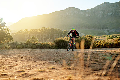 Buy stock photo Scenic, mountain biking and sports with man in nature for adventure, hobby or journey on space. Exercise, fitness or training and cyclist person outdoor for adrenaline or recreation with view