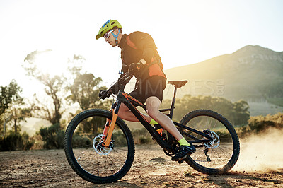 Buy stock photo Bike, dust and off road with man in mountains for outdoor adrenaline, adventure or training. Exercise, fitness and hobby with sports person cycling in nature for challenge, competition or performance