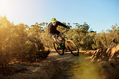 Buy stock photo Mountain bike, fitness and cyclist with sports race, workout or cardio exercise on dirt road. Cycling, triathlon and male athlete riding on dust trail for competition training with adventure.
