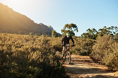 Buy stock photo Mountain bike, speed and man with dirt road race, workout or cardio exercise in nature. Fitness, triathlon and cyclist on dust trail for cycling competition, challenge or training with adventure.