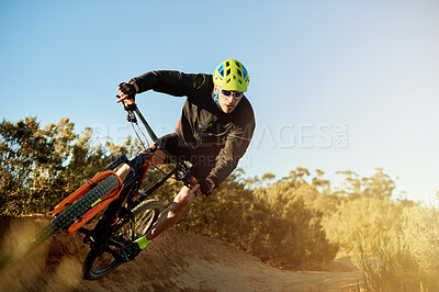 Buy stock photo Man, cycling and mountain bike with dirt track for adrenaline rush, fitness or extreme sport in nature. Male person, cyclist or riding with bicycle or helmet for cardio workout on path, road or trail