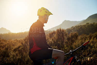 Buy stock photo Exercise, man and mountain bike outdoor for cycling, health and planning journey with sunset view. Nature, rider and bicycle for sports, off road adventure or thinking of cardio training for fitness