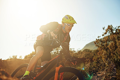 Buy stock photo Bike, concentration and sports with man in mountains for outdoor adrenaline, adventure or training. Exercise, fitness and trail with person cycling in nature for challenge, competition or performance
