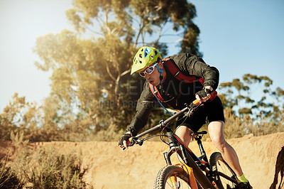 Buy stock photo Bike, speed and sports with man in mountains for outdoor adrenaline, adventure or training. Exercise, fitness and trail riding with person cycling off road for challenge, competition or performance