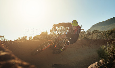 Buy stock photo Bike, fast and trail with man in mountains for outdoor adrenaline, adventure or training. Balance, exercise or fitness and sports person cycling in nature for challenge, competition or performance