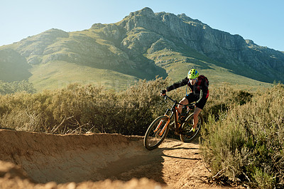 Buy stock photo Cycling, mountain bike and view with man outdoor for adrenaline, adventure or training. Exercise, fitness and hobby with person trail riding in nature for challenge, competition or performance