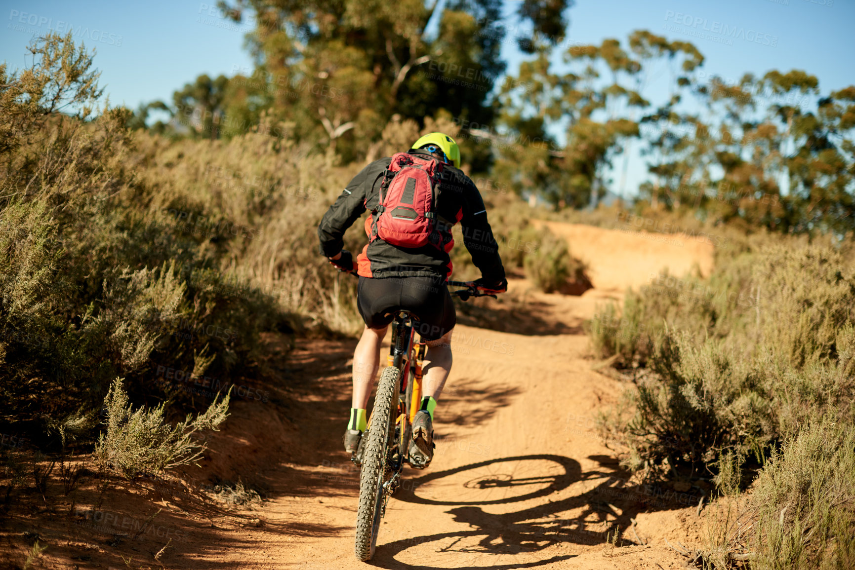 Buy stock photo Back, man and bike on mountain for fitness, challenge and sport on dirt path. Athlete, bicycle and cycling on nature trail for exercise, cardio training or travel in environment for outdoor adventure