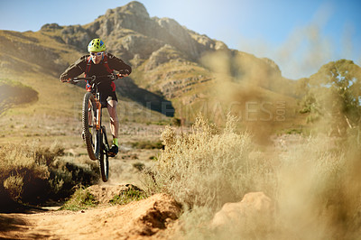 Buy stock photo Mountain bike, jump and man with fitness, energy and environment with challenge. Healthy person, extreme sports and cyclist with practice, trick or dirt road with hobby, bicycle skills or competition
