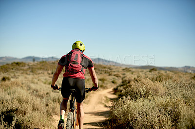 Buy stock photo Sports, nature and back of cyclist with exercise, challenge or cardio workout for endurance. Fitness, outdoor and athlete riding mountain bike for cycling race, competition or triathlon training.