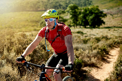 Buy stock photo Cycling, helmet and off road with man in mountains for outdoor exercise, fitness or hobby. Bike, sunglasses and trail with person on bicycle in nature for challenge, performance or sports training