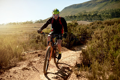 Buy stock photo Cycling, sports and man riding on dirt road for gravel race, challenge or competition training. Fitness, mountain bike and athlete cyclist driving on trail outdoor for exercise or workout in nature.