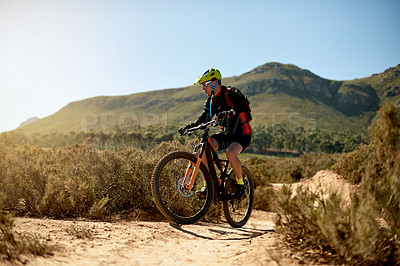 Buy stock photo Mountain bike, sports and man riding on dirt road for gravel race, challenge or competition training. Fitness, cycling and athlete cyclist driving on trail outdoor for exercise or workout in nature.