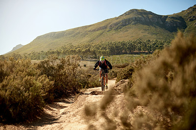 Buy stock photo Mountain bike, fitness and man riding on dirt road for gravel race, challenge or competition training. Sports, cycling and athlete cyclist driving on trail outdoor for exercise or workout in nature.