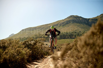 Buy stock photo Nature, fitness and man cycling on dirt road for gravel race, challenge or competition training. Sports, mountain bike and athlete cyclist riding on trail outdoor for exercise or workout in nature.