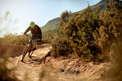 Buy stock photo Cycling, fitness and man on dirt road trail for gravel race, challenge or competition training. Sports, mountain bike and male athlete cyclist riding in mud outdoor for exercise or workout in nature.
