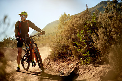 Buy stock photo Man, cyclist and mountain bike with dirt road for fitness, workout or outdoor adventure in extreme sport. Male person, bicycle and nature with helmet for adrenaline rush on path or natural trail