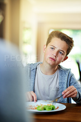 Buy stock photo Upset, child and dislike salad at dinner table for eating vegetables and no to nutrition at home. Healthy, brussel sprout and face with disgust, refuse and fussy eater with balanced diet and food