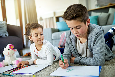 Buy stock photo Kids, siblings and coloring homework in home, books and artistic activity for creative education. Children, drawing together and bonding on floor of living room, support and learning lesson for skill